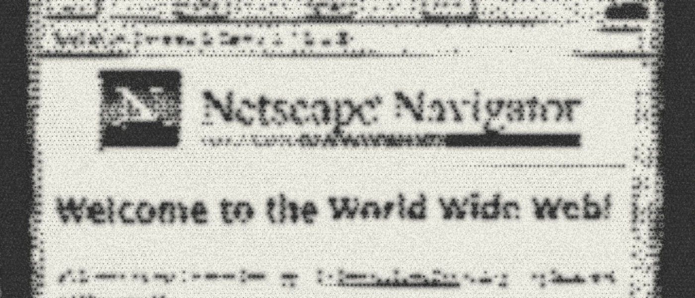 Close-up photo of a CRT monitor displaying Netscape Navigator with Welcome to the World Wide Web